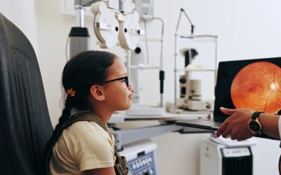 Doctor, laptop or girl in eye test at optometry at optometry clinic for eyewear diagnosis or sight .